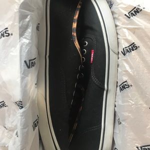 black vans with leopard detailing